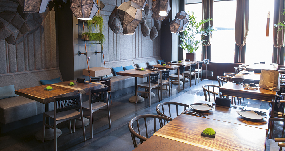 A restaurant with moss hedgehogs on tables