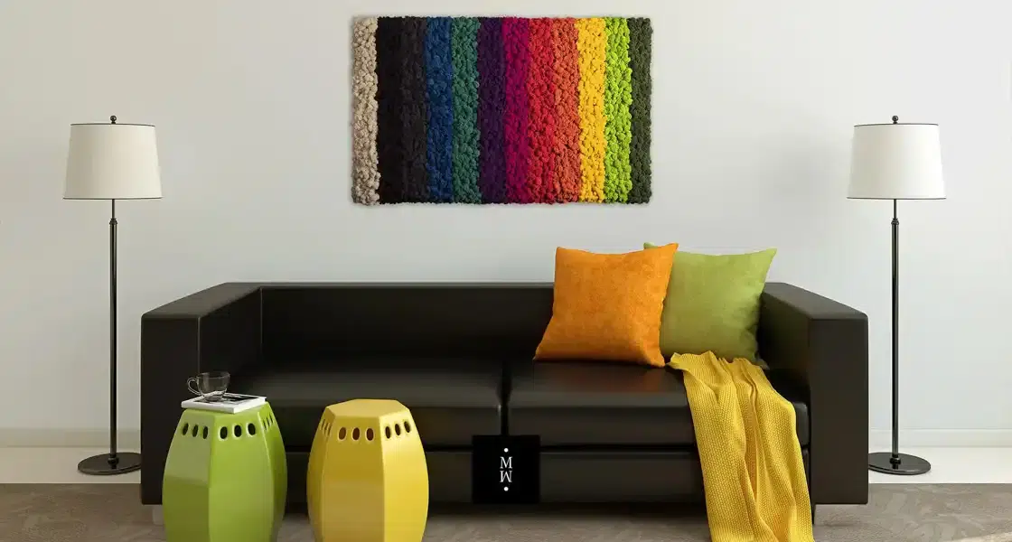 a couch with pillows and a rug on the wall