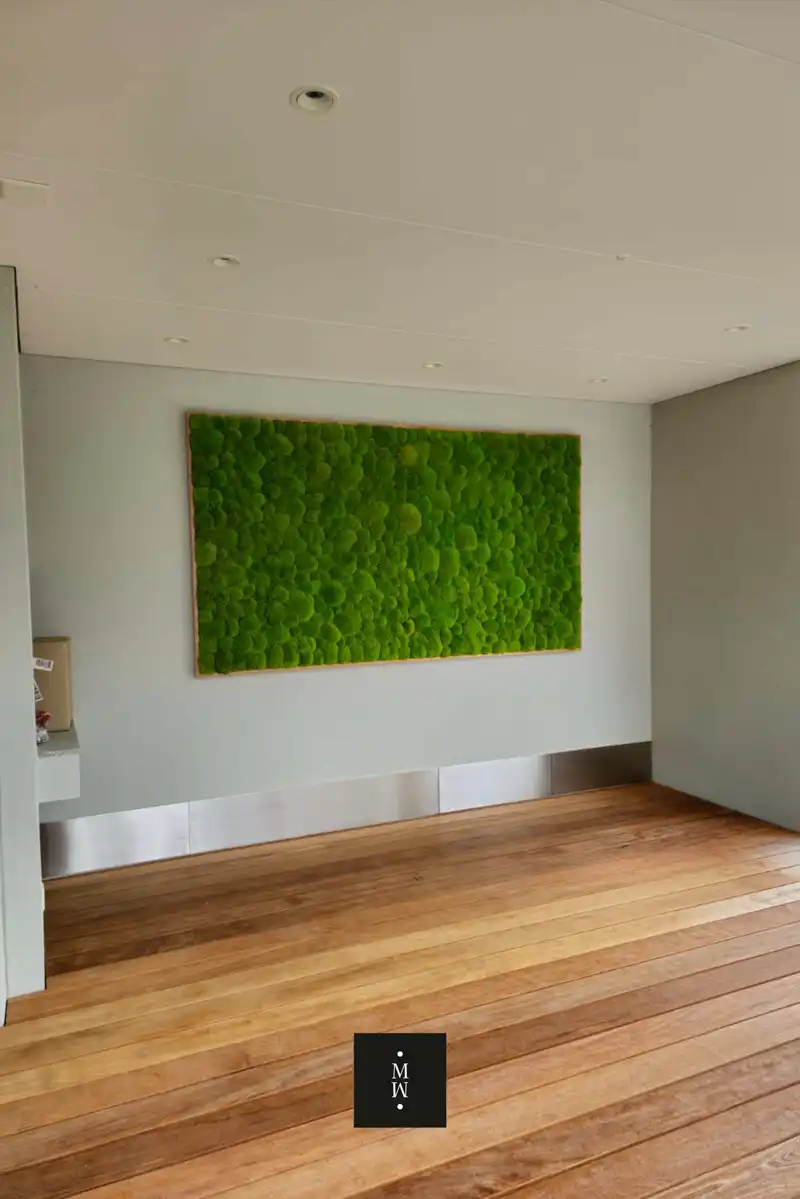 a green art on a wall