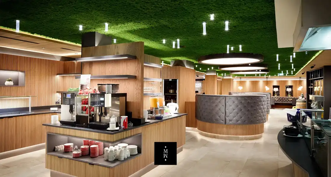 a restaurant with green ceiling
