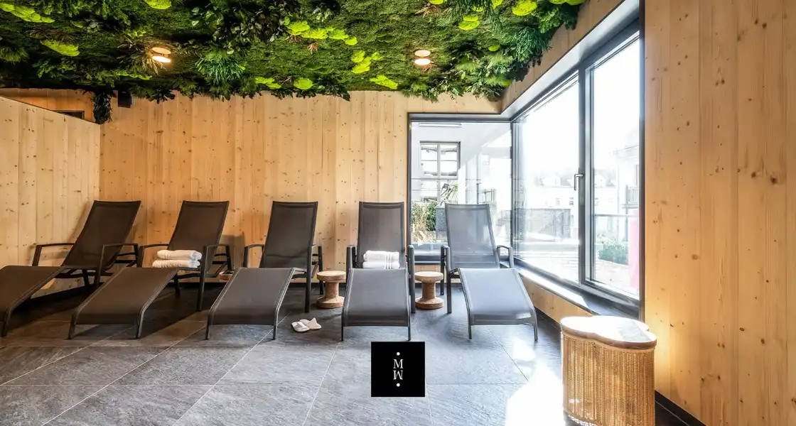 a room with chairs and a green ceiling